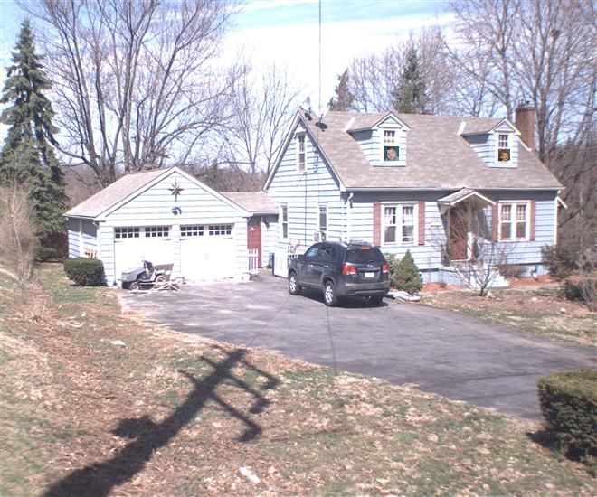 Baby Cay and Chay 'inside' of their OLD HOUSE (which was originally BROWN but apparently has been PAINTED since this picture was CREATED with a photo I found of our OLD HOUSE on the WEB!)!